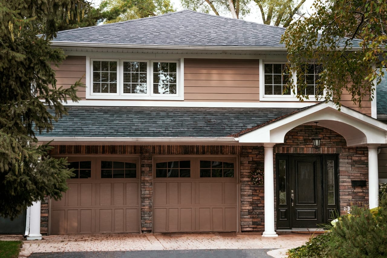 tan house with garage